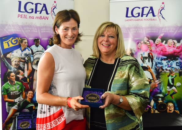 Joan Duffy (left) receives her special 25-year commemoration medal from LFGA President Marie Hickey at Croke Park on All-Ireland finals day. (Pic: Sam Barnes/Sportsfile)