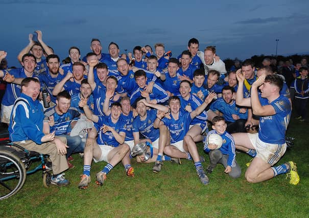 Naomh Máirtín celebrate last year's Cardinal O'Donnell Cup success. (Pic: Arthur Kinahan)