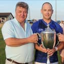 Seamus Sheelan presenting the Paddy Sheelan Cup to St. Mary’s captain Darren Clarke  with Louth County Board chairman Des Halpenny. (Pic: Arthur Kinahan)