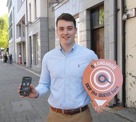 Ross Kernan showing off his new app Q Kangaroo
