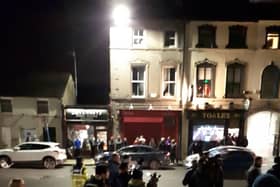 A crowd of people had gathered on the street waiting for the accused teenager Mohamed Morei to arrive.