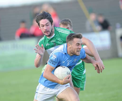 Andy McDonnell (Newtown Blues) is tackled by Eoin O'Connor of St. Patrick's. (Pic: Arthur Kinahan)