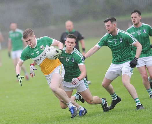 St. Josephs' Killian Staunton is chased by Matthew Corcoran and Stephen Reidy of the Geraldines. (Pic: Arthur Kinahan)
