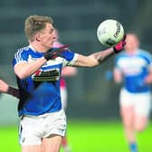 Laois' David Conway wins this ball in front of Louth's Kevin Carr