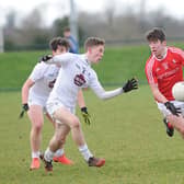 Louth's Eoghan Callaghan runs at the Kildare defence