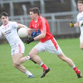 Louth's Conal McKeever taking on Tyrone's Lee Brennan. Picture: Arthur Kinahan