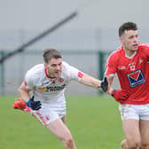 Louth debutant Conor Branigan holds off Tyrone's Michael Cassidy. Picture: Arthur Kinahan