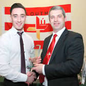 Derek Maguire receives his Louth Player of the Year award from County Board Chairman Des Halpenny