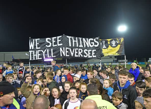 Dundalk fans celebrate their side’s title win at Oriel Park on Sunday night. picture: Ciaran Culligan