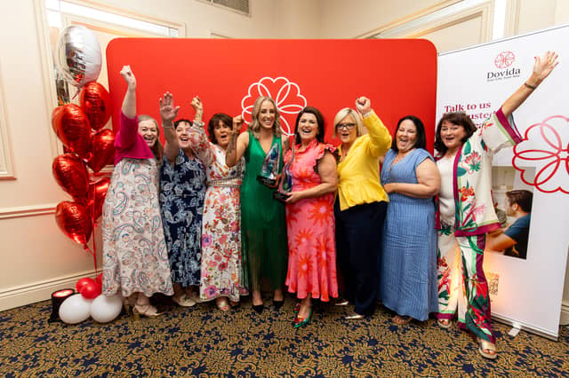 Emma McGrath (centre left), celebrates with Dovida Louth General Manager, Allison Doggett (centre right), and the Dovida Louth team