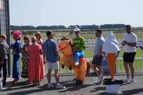 Racegoers in line for a ice cream at The Curragh Racecourse in County Kildare