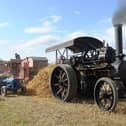 Old style threshing with a 1912 Fowler B8  steam engine at a previous Knockbridge Vintage Rally