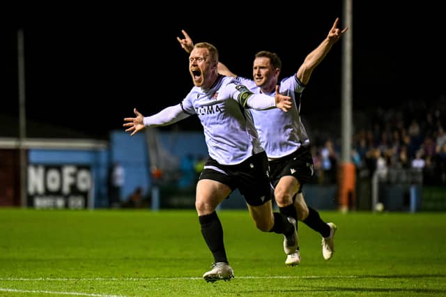 Daryl Horgan of Dundalk celebrates with teammate Bobby Burns, right, after scoring their side's third goal during the SSE Airtricity Mens Premier Division match between Drogheda United and Dundalk at Sullivan & Lambe Park in Drogheda, Louth.