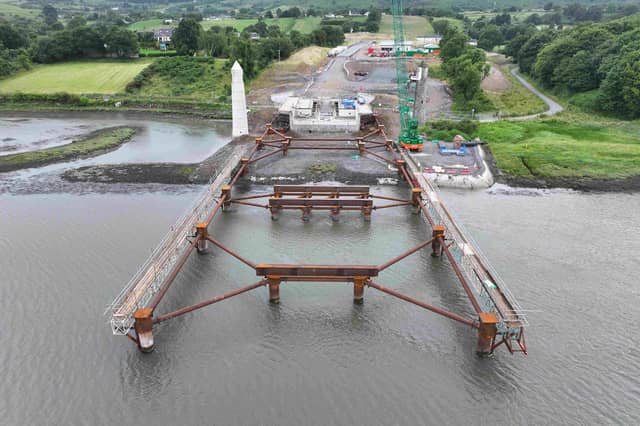 A key milestone has been reached in the construction of the €102 million Narrow Water Bridge, with temporary structures designed by Belfast’s AM Consulting Engineers (AMCE) now extending into the River Newry from both banks. For the first time, passersby can now get a sense of how the long-awaited bridge will eventually span the river, as two new 65m structures extend from each bank into the River Newry.