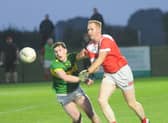 Stephen O'Reilly of Naomh Fionnbarra (left) and Kevin McShane of Naomh Malachi contest this ball in the DKIT JFC quarter-final at Darver