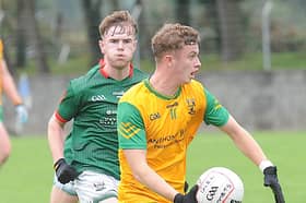 Conor Clinton of Stabannon Parnells gets away from Callum Wogan of Glen Emmets