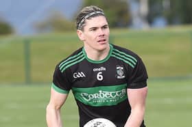 Jordan O'Donoghue setting a Dunadlk Young Ireland's attack