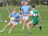 Liam Branagan of Newtown Blues taking on St Patricks' Micheal O'Shaughnessy 