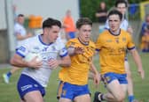 John O'Hare of Dundalk Gaels taking on St. Mochtas Conor Gartland and Oisin Callan