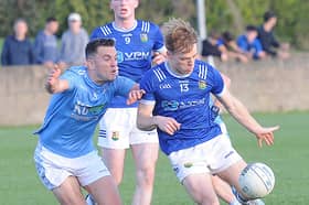 Andy McDonnell of Newtown Blues attempts to block Ciarán Keenan of St. Mary's