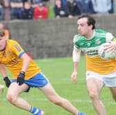 Oisin McGuinness of St. Joseph's taking on Jamie Farrell of St. Mochta's