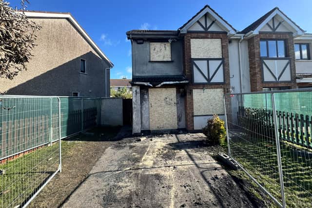 The windows and doors on the house have been boarded up (Mícheál Ó Scannáil/PA)