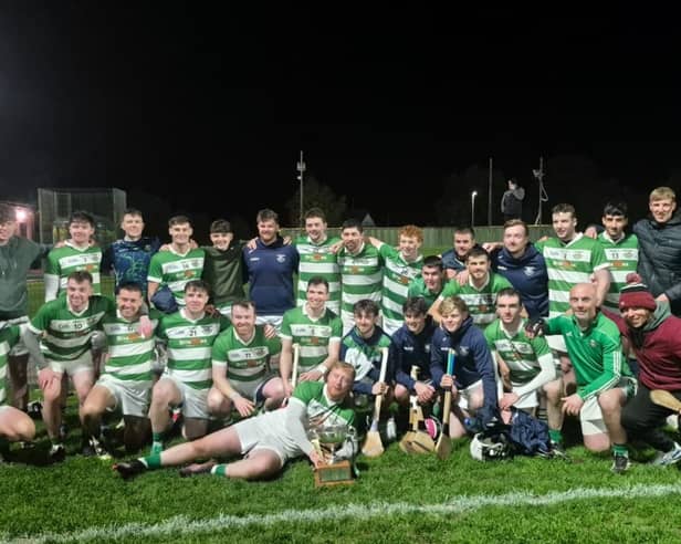 St. Fechins players celebrate with the league trophy