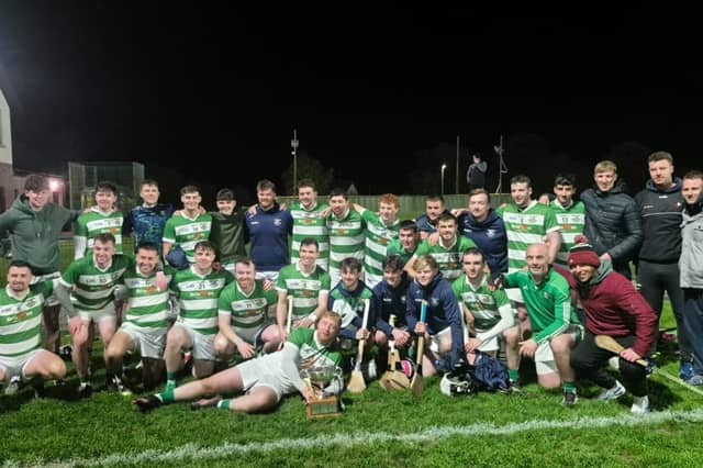 St. Fechins players celebrate with the league trophy
