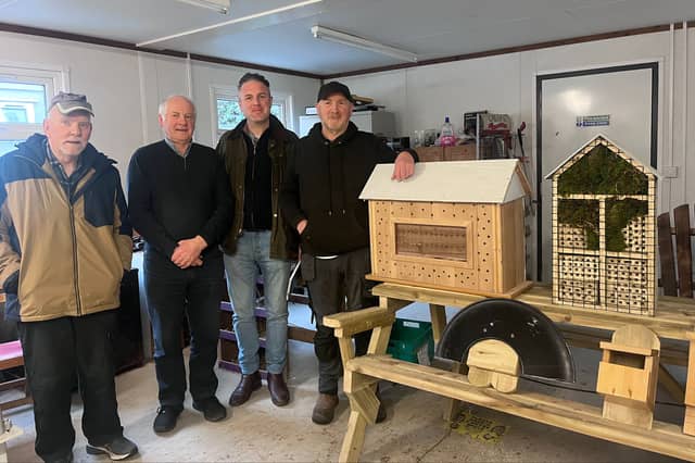 Ben McCabe, pictured with members of the Carrickmacross Men's Shed Pearse Callan, Frank Ward, and Hugh Crawley