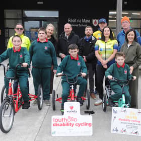 Mark Fitzimons and James O'Hanlon with Réalt na Mara pupils and teachers and members of the Louth Disability Cycle Club