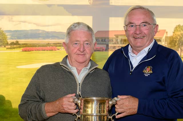 Austin Shaw, winner of the 2026 Veteran’s Cup at Dundalk Golf Club, receives the trophy from Captain Michael O’Sullivan