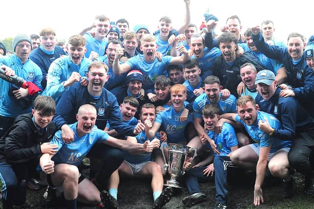 Newtown Blues celebrate with the 2026 Joe Ward Cup after defeating St. Mochtas at Integral GAA Grounds, Drogheda