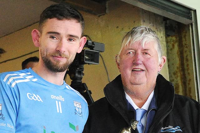 Seamus Keenan (Anchor Tours sponsor) presents Ciarán Downey with his Man of the Match award
