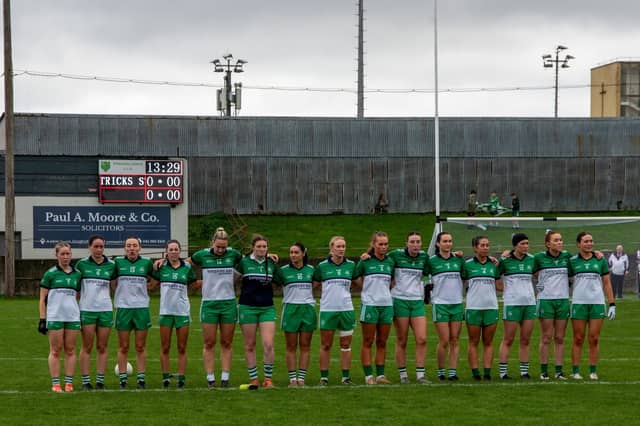 St. Patricks players stand for the national anthem