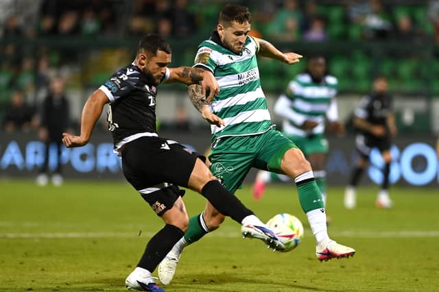 Leo Gaxha of Dundalk in action against Lee Grace of Shamrock Rovers
