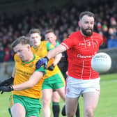 Cillian Kirk of St Bride's can only watch as Dylan Shevlin sends over a Stabannon score 