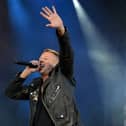 Macklemore performing on stage