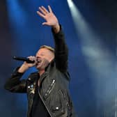 Macklemore performing on stage