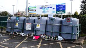 Glass bottles littered around overflowing Dundalk bottle bank