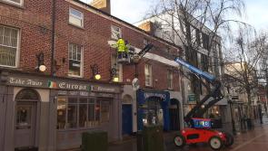 Project to restore old signage on Earl Street buildings in Dundalk begins