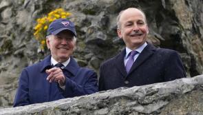 US president cheered by well-wishers waiting in the rain in Carlingford
