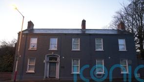 Two men charged over fire at asylum seeker accommodation centre