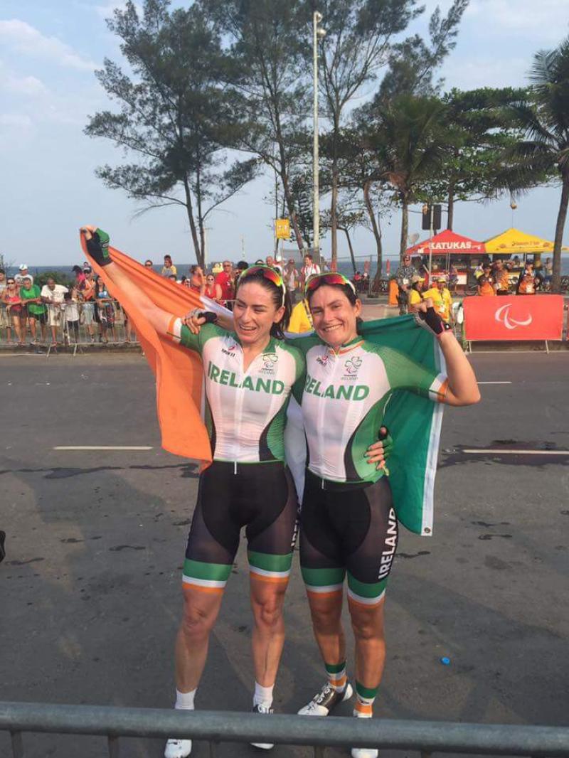 President Higgins congratulates McCrystal and  Dunlevy's medal success