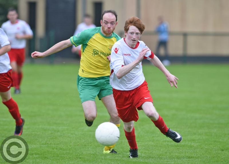 11-goal Rock advance in Tully Cup