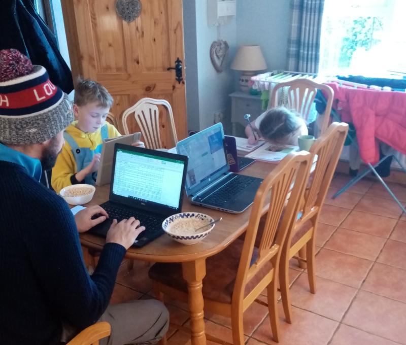 Erin and Danny Gallagher working at home as is their Daddy Mark