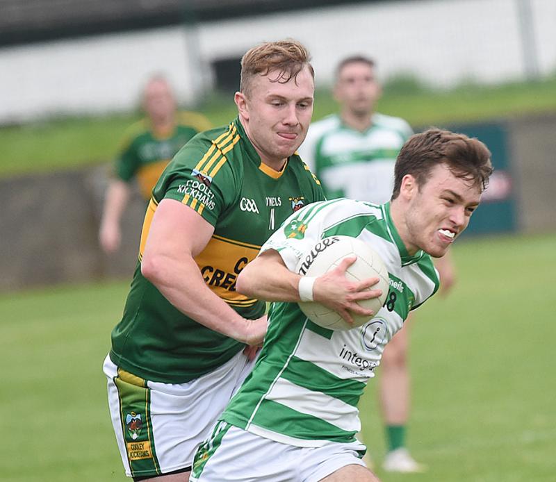 O'Raghalligh's Eoin Moore getting away from Cooley Kickham's Fergal Malone