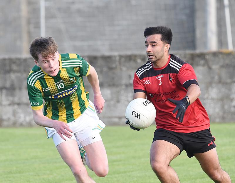 Aaron Khan of St Kevins against Clan Na Gael's Jack Callan