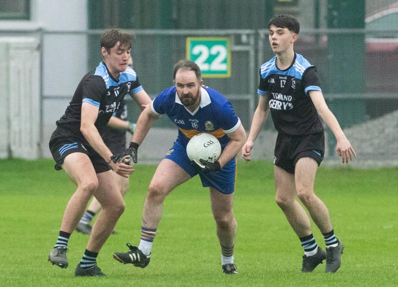 Wolf Tones Kevin Brady breaks past Ballinagar's Geordi O'Meara and Conor Bracken during the AIB Leinster GAA Junior Football Club Championship in Glenisk O'Connor Park. Picture by Ger Rogers