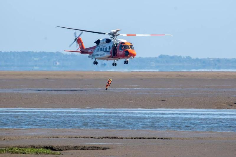 Two Spanish teenagers rescued after getting trapped in sand and surrounded by rising water at Louth beach