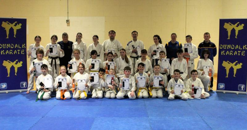 Senior Members of Dundalk Karate with their Grading Certificates alongside Sensei Mary Marcus 4th Dan, Sensei Liam Hoey 1st Dan and Sensei Thea Mulholland 1st Dan